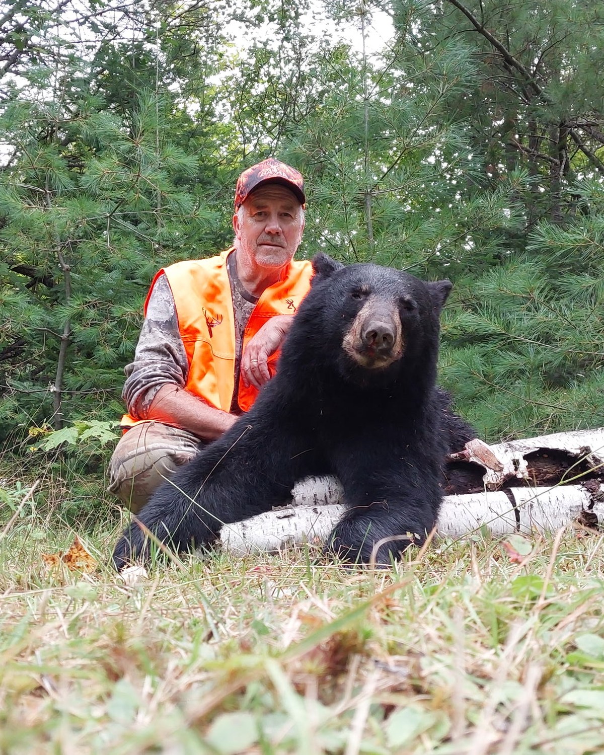 Kevin posing with his black bear after an opening-day hunt near Bootjack, Michigan